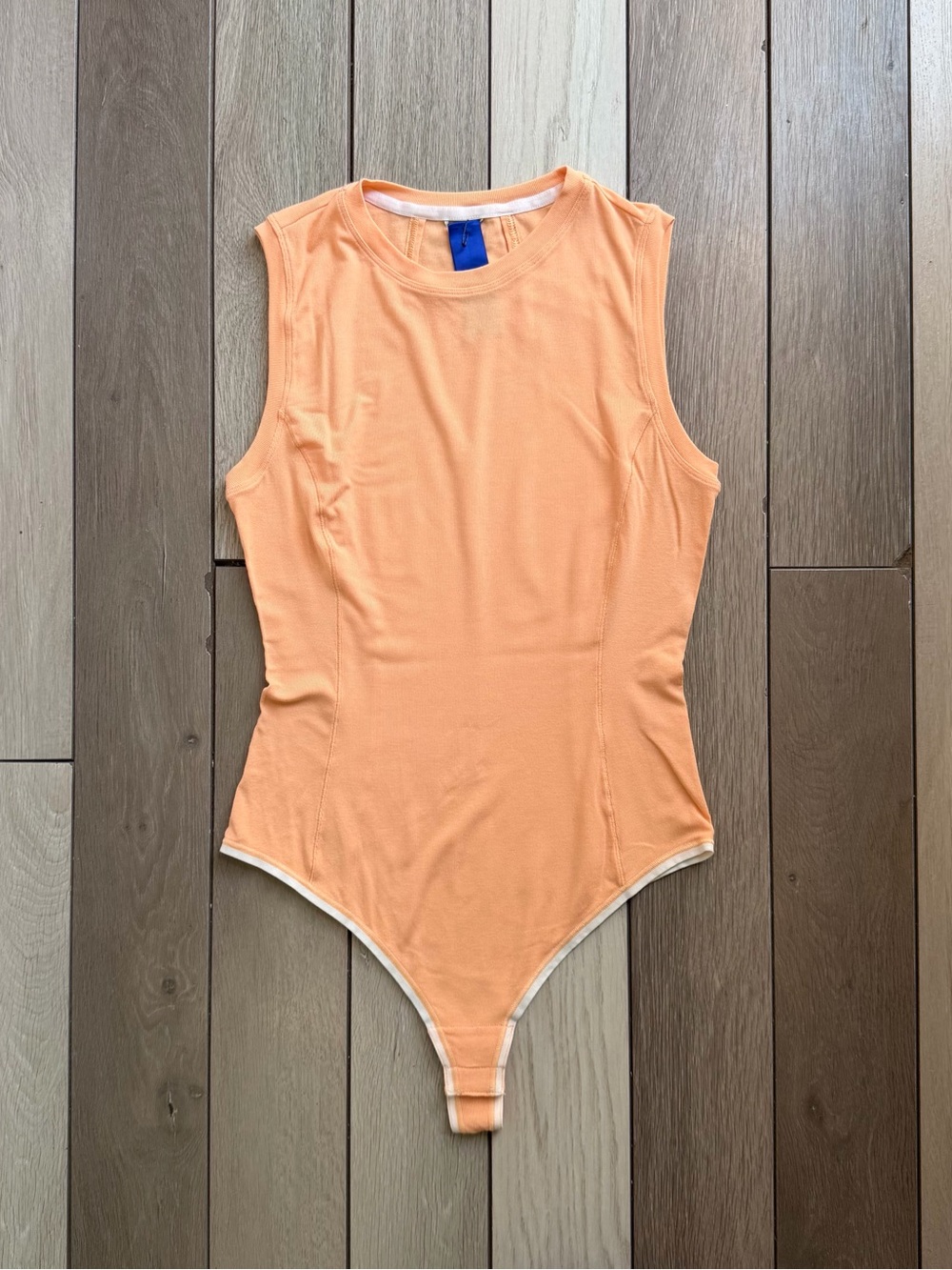 Kit and Ace Sleeveless One-Piece Bodysuit in Peach Orange